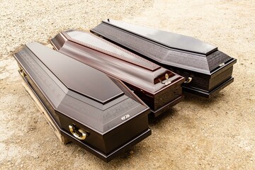 Elite coffins on pallet for transportation. Three types of coffin models made at Elite Grob...