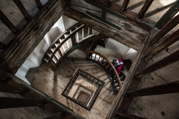 Looking down the wooden staircase of Lindau's lighttower, Lake Constance, Germany - obrazy, fototapety, plakaty