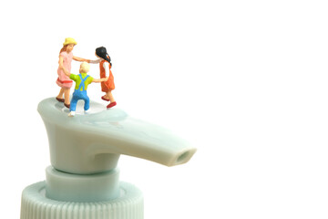 Miniature people toy figure photography. Health protocol on pandemic concept. A group of kids...
