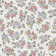 Cute floral pattern in the small flower. Seamless vector texture. Elegant template for fashion prints. Printing with small white, blue and pink flowers. Light white gray background. Stock print.