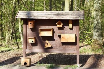 Wooden feeders for different birds.