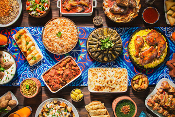Arabic Cuisine: Middle Eastern traditional lunch. It's also Ramadan "Iftar". The meal eaten by Muslims after sunset during Ramadan. Assorted of Arabic oriental dishes. top view with close up. 