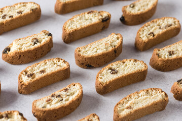 Crunchy Biscotti with Raisin and Almonds on Gray Background Pattern Horizontal Above