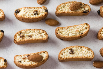 Crunchy Biscotti with Raisin and Almonds on Gray Background Pattern Horizontal Above