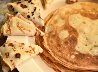 Delicious and juicy pancakes with sour cream