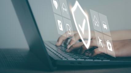 Insurance online digital technology concept. Hand using labtop buy family, car, health and travel Insurance Policy Protection icon on virtual screen , Accident Claim Risk Defense.