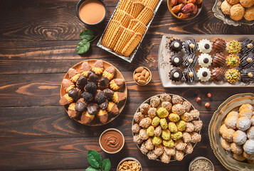 Arabic Cuisine; Cookies for celebration of El-Fitr Islamic Feast.(The Feast that comes after Ramadan). Varieties of Eid Al-Fitr sweets (kahk,biscuits, petit four). Top view with copy space.