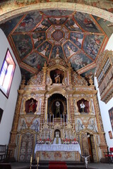 Fototapeta na wymiar Icod de los Vinos, Tenerife, Spain, April 25, 2022: Colorful mallor altar of the church of Saint Francisco in Icod de los Vinos, Tenerife. Spain