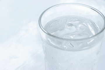 Water glass with some ice selective focus, blur some part.