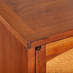 Original 1964 mid-century modern credenza. Walnut sideboard buffet with cane weave details. Vintage 1960s style. Corner detail view.