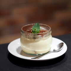 Italian Tiramisu dessert in a glass jar