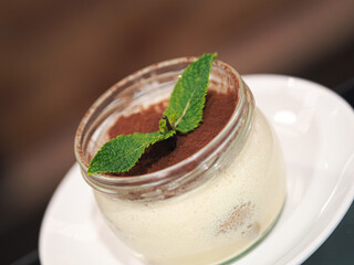 Italian Tiramisu dessert in a glass jar