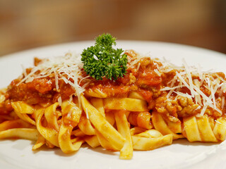 Close up of a dish of Italian pasta with sauce.