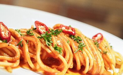 Close up of a dish of Italian pasta with sauce.