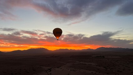 Hot Air Balloon Over the Desert Sunrise