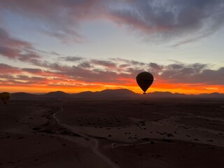 Hot Air Balloon Over the Desert Sunrise