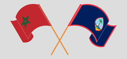 Crossed and waving flags of Morocco and Guam