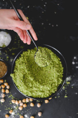 Ingredients to make falafel. Grounded chick peas.  Green healthy food. Vegan delicious dish. Vegetarian meal. Food preparation. Arabic dish.