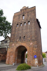 Square brick tower with barrel vaulted passageway and gabled roof, Neuperver Tor in Salzwedel. Germany.