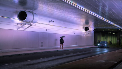 people walking in the tunnel