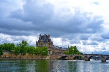 Fototapeta premium panorama of the embankment of the Seine and the Louvre in Paris