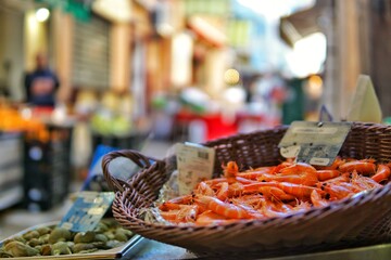 platter with shrimp on the shopping street of a mediterranean city