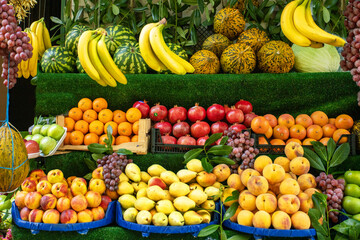Street Fruit Shop with fresh fruits and vegetables in Istanbul, Turkey. Autumn fruits harvest in market.