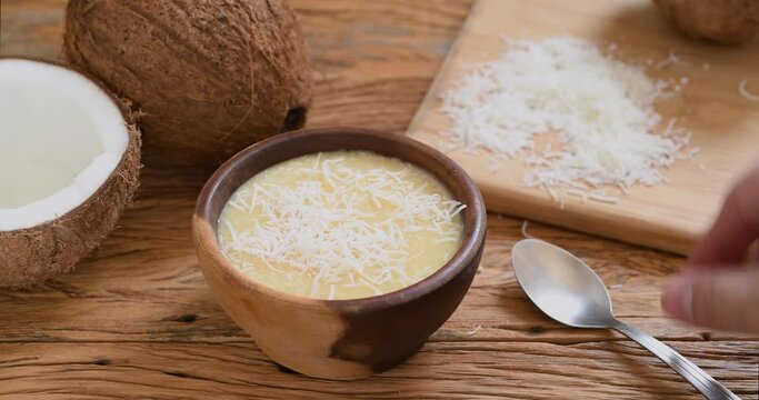 Creamy cocada, traditional brazilian coconut candy with grated coconut