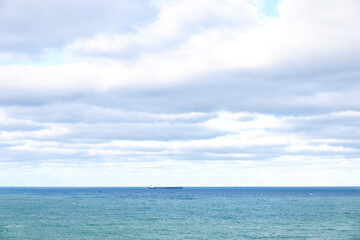 Fototapeta na wymiar Views on the horizon of a cargo ship sailing. Oil transport concept