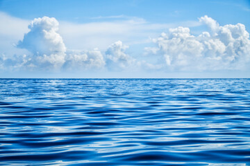 Empty blue sea and blue sky. Focus on the foreground.