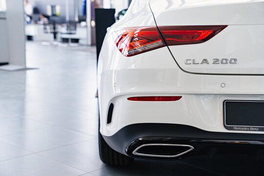  tail light of a white Mercedes CLA 200 car in the parking of a car dealership