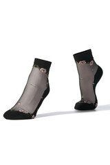 Close-up shot of black transparent socks with black mesh, decorated with embroidery floral ornament. The pair of black socks is isolated on a white background. Side view.