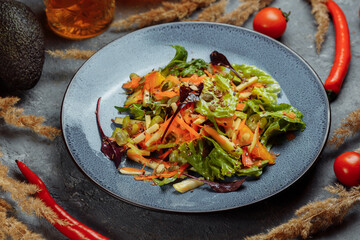 Sicilian salad with fennel, oranges, grapefruit and radicchio salad with balsamic dressing on a blue linen tablecloth. healthy summer italian food