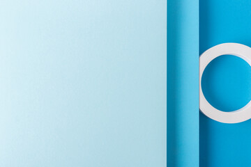 Round podiums on light blue background design of folded paper material. Top view, flat lay