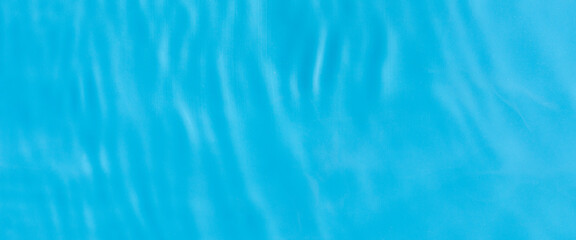 Bursts on blue water under sunlight. Top view, flat lay. Banner