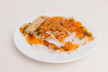 Banh Beo, Vietnamese steamed rice cakes also known as water fern cakes with dried shrimps, spring onion fish sauce, Vietnamese food isolated on white background, close up view