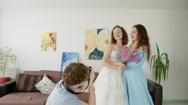 4K. A young bride and her friend are photographed by a photographer