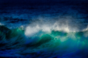 Fototapeta na wymiar Misty Dreamy Waves on a Beach from Ocean Swell Water Blue Clean Fresh