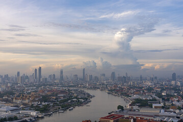 Fototapeta na wymiar Cityscape of Bangkok at sunrise with View of Grand Palace and Chao Phraya River From Above