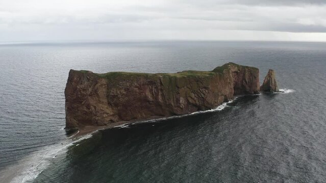 Perce rock in the atlantic ocean and cloudy day
