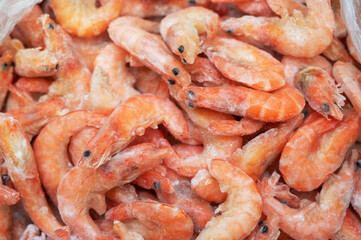 Frozen shrimp in fridge at the fish market. Healthy eating and fish market concept