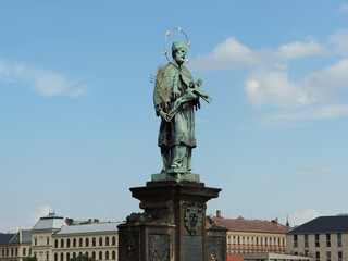 Fototapeta na wymiar Historical religious statues on Charles Bridge in Prague - the capital city of Czech Republic.