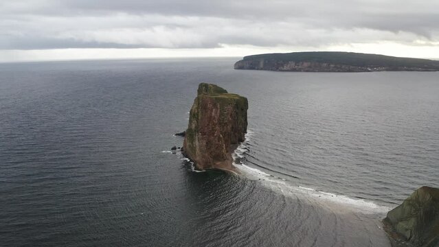 Perce rock in the atlantic ocean and cloudy day