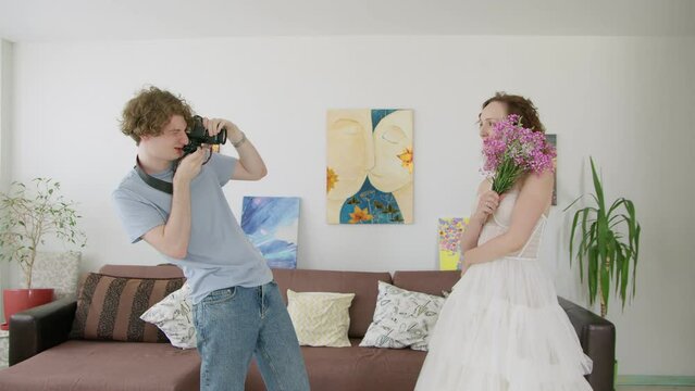 4K. A young bride is photographed by a photographer