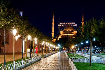 Istanbul, Turkey: Blue Mosque in the evening light. The illuminated inscription means: Muhammad is the messenger of Allah.