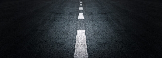 Asphalt road texture background, black tarmac surface with white marking stripes, Transport urban background, and Dark street texture detail. - Powered by Adobe