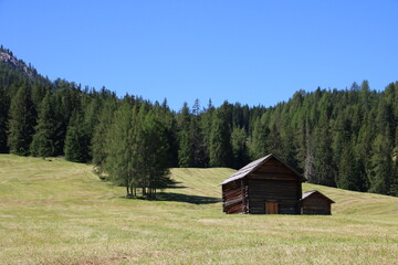 small wooden hut in the mountains
