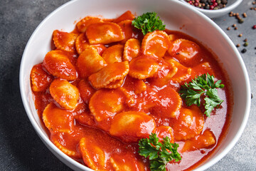 ravioli fish stuffed pasta tomato sauce fresh dish healthy meal food snack diet on the table copy space food background 