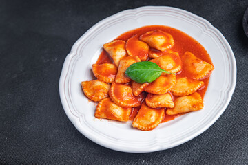 ravioli fish stuffed pasta tomato sauce fresh dish healthy meal food snack diet on the table copy space food background 