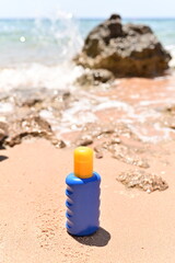 tubes of cream on the beach